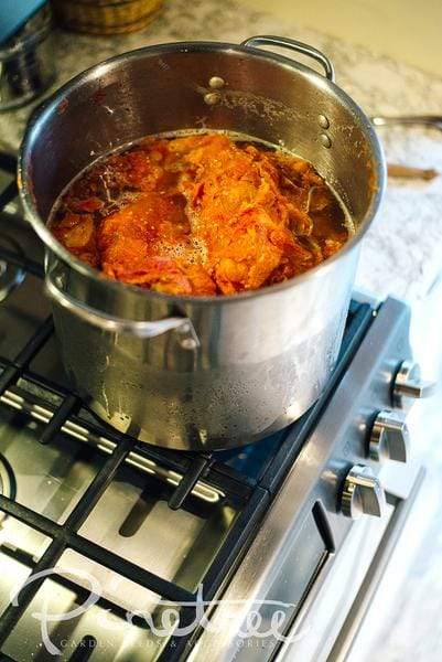 Pot on stove with sauce bubbling