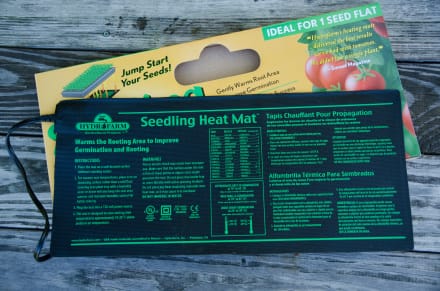 Pinetree black seedling heat mat with bright green instructions.